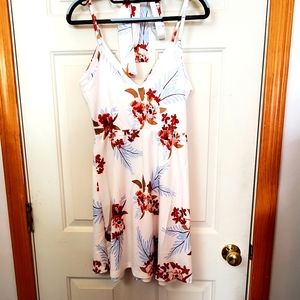 Casuress small v-neck swing skater dress. Floral print, spaghetti straps.